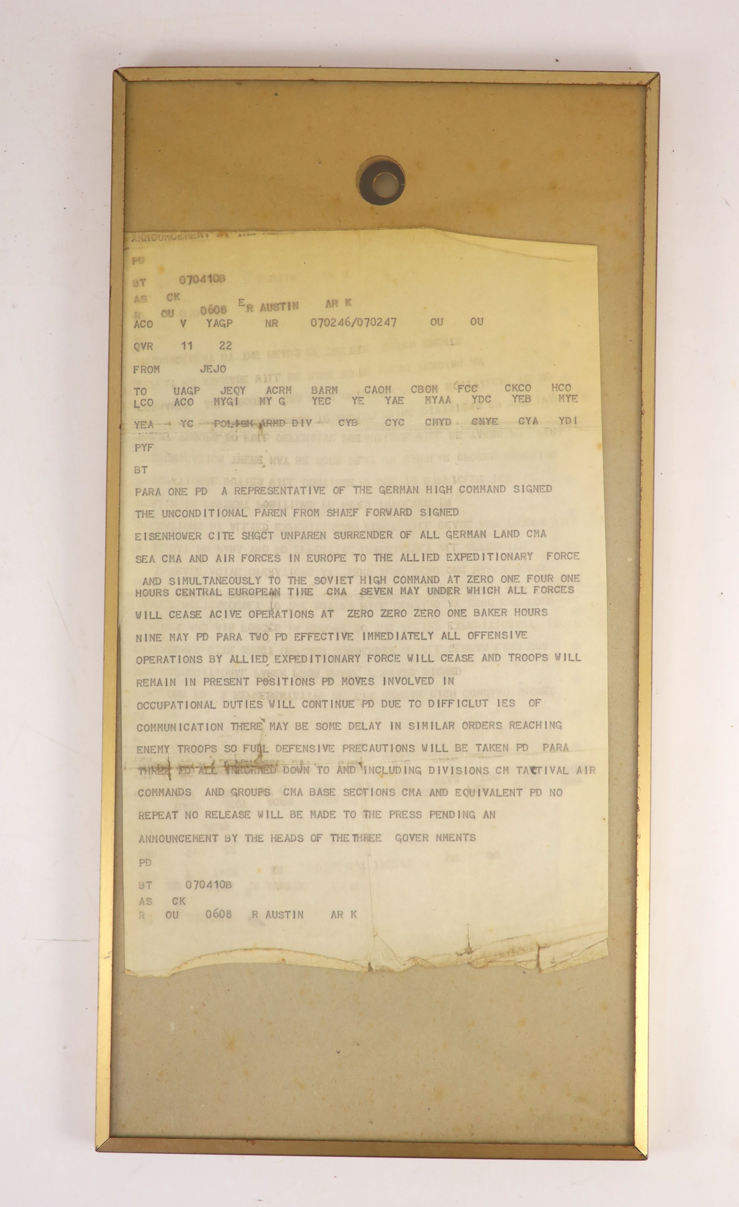 A contemporaneous Telex copy of the notification of the unconditional surrender of the German high command in WW2, 7th May, 1942, single sheet, printed in black